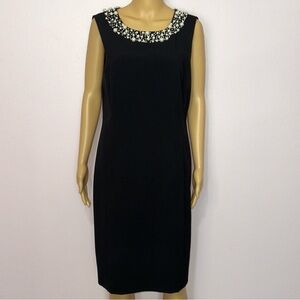 Elegant Black Sleeveless Dress with Embellished Neckline